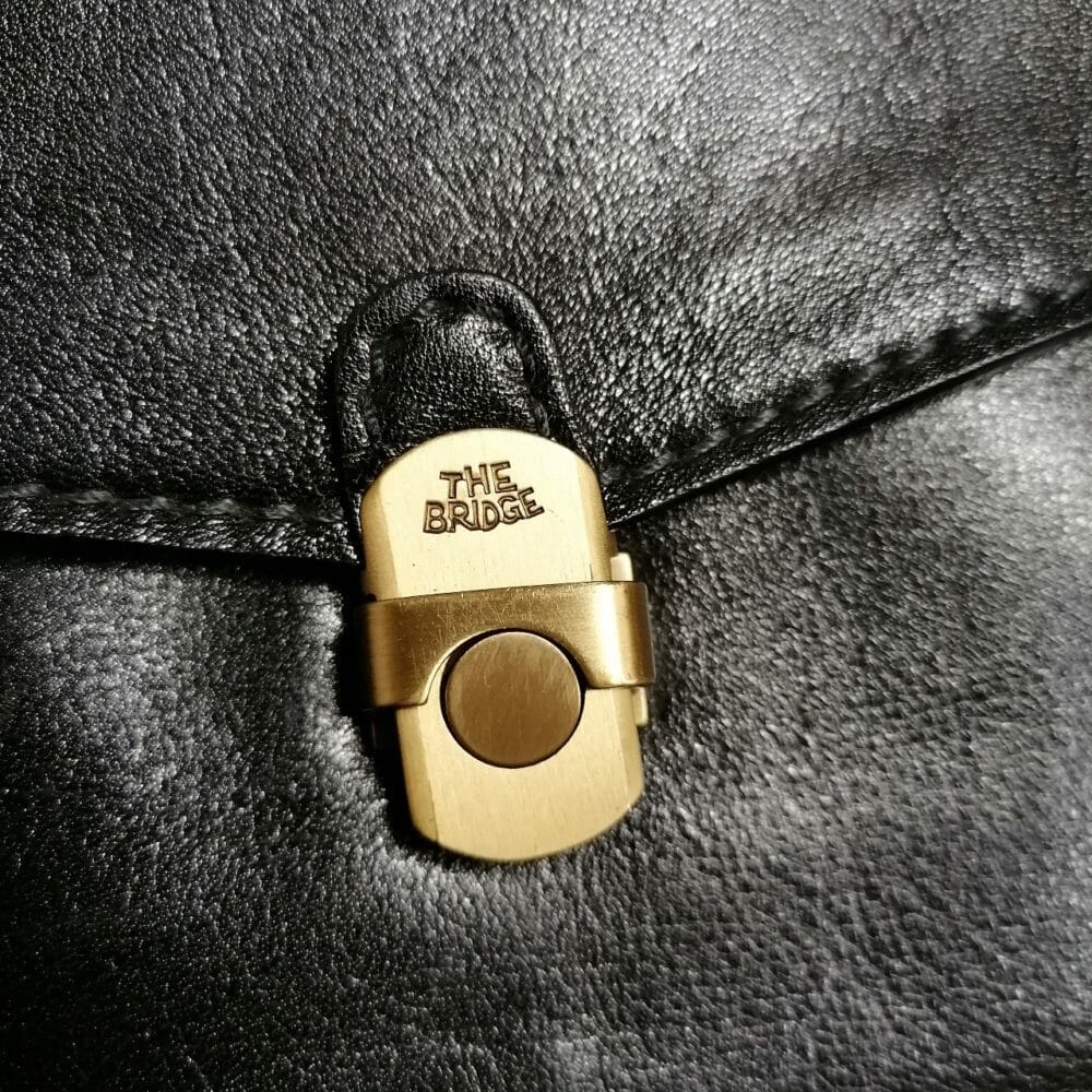 The bridge - il ponte, cartella /borsa a mano con comodo cinghino da polso, nuova